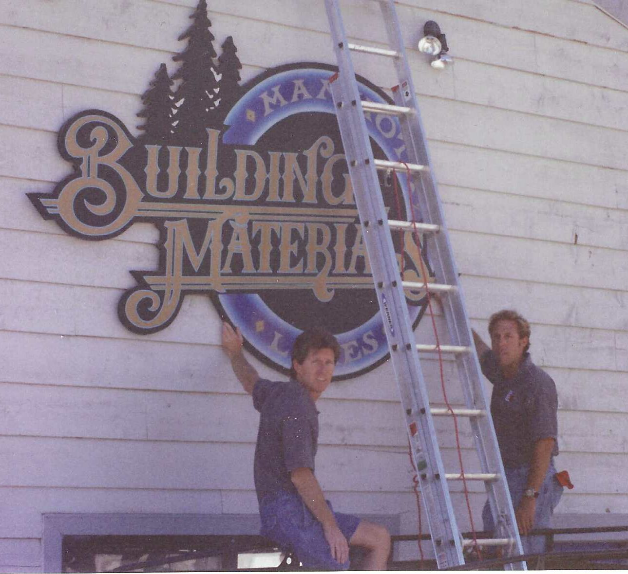 Scott Piercey and Steve Joseph putting up Building Sign
